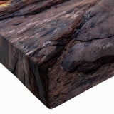 Close-up of a vibrant stretched canvas wall art design showcasing intricate canyon landscapes with rich colors, perfect for enhancing modern decor in living spaces.