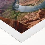 Rolled canvas showcasing a vibrant landscape of canyons in warm earth tones, designed for wall art collection, highlighting its textured surface and artistic detail.