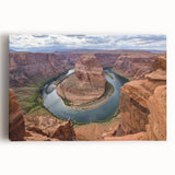Stretched canvas wall art featuring a vibrant landscape of canyons, showcasing rich earthy tones and dramatic textures, ideal for home decor enhancement.