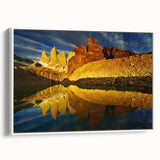 Framed canvas wall art featuring a stunning landscape of canyons in warm earth tones, displayed with a sleek white frame, perfect for home decor enthusiasts.