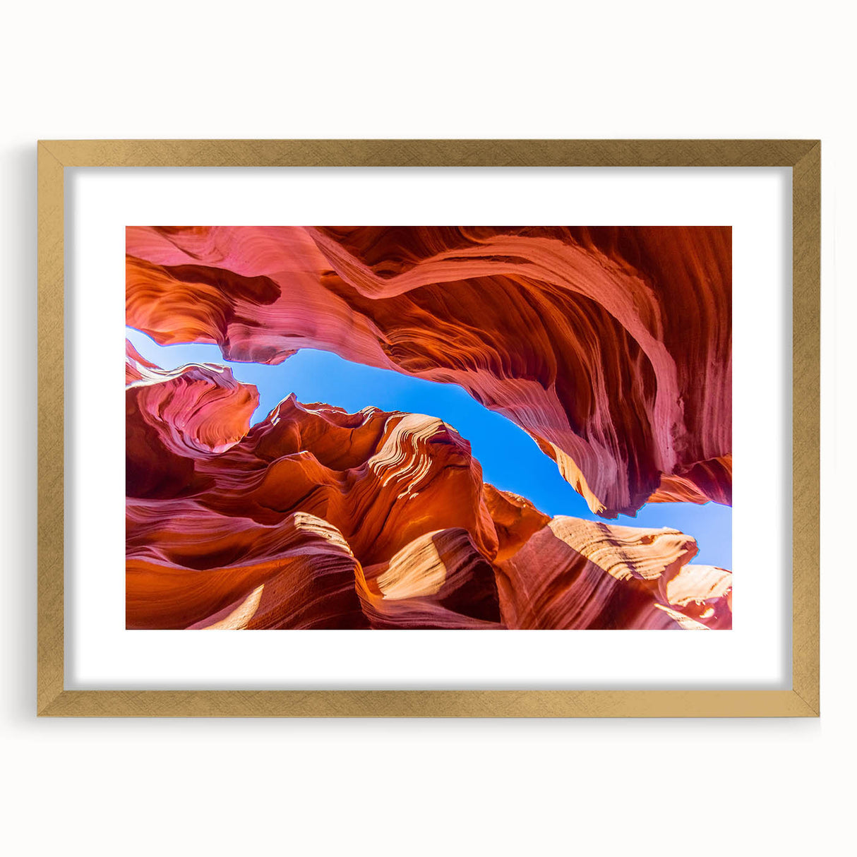 Framed wall art collection showcasing a stunning canyon landscape design with a gold mat, ideal for home decor. This piece adds elegance and depth to any room.