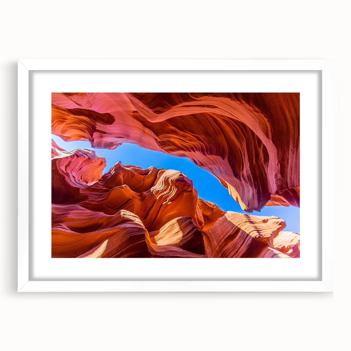 Framed wall art featuring a stunning landscape of canyons, showcasing earthy tones and intricate details, ideal for home decor with a modern aesthetic.