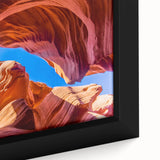 Close-up of a framed canvas wall art piece showcasing a vibrant landscape of canyons, featuring rich colors and intricate details, perfect for home decor enthusiasts.