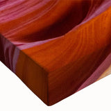 Close-up of a stretched canvas print showcasing a vibrant canyon landscape design, emphasizing rich colors and intricate details, perfect for home décor.