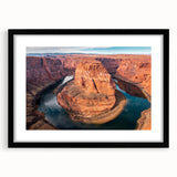 Framed wall art showcasing a stunning canyon landscape, featuring earthy tones and intricate details, ideal for home decor. Black frame enhances the artwork.
