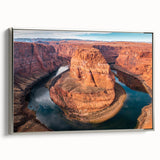 Framed canvas wall art depicting a vibrant canyon landscape with rich colors and intricate details, featuring a sleek silver frame, ideal for modern home décor.
