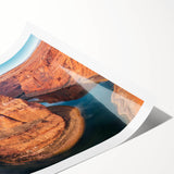 Stunning wall art print showcasing a vibrant canyon landscape in rich earth tones, rolled and ready for display, emphasizing nature's beauty and artistic design.