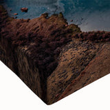 Close-up of a stretched canvas wall art piece showcasing a vibrant desert canyon landscape, featuring rich earthy tones and intricate details, perfect for home decor.