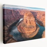 Stretched canvas wall art showcasing a vibrant canyon landscape with rich earthy tones, perfect for adding a natural touch to home decor.