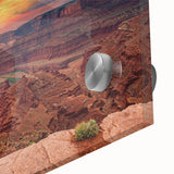 Close-up of a vibrant acrylic glass wall art piece depicting a stunning canyon landscape, showcasing rich earth tones and intricate details, perfect for home decor.