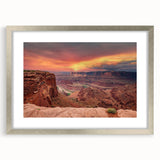 Framed wall art showcasing a stunning landscape of canyons, featuring rich earth tones and silver matting, ideal for enhancing modern home decor.