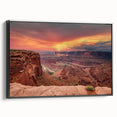 Framed canvas wall art showcasing a stunning canyon landscape in rich earthy tones, featuring a sleek black frame, perfect for enhancing modern home decor.