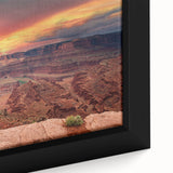 Close-up of a framed canvas artwork depicting vibrant landscapes and canyons, showcasing intricate details and rich colors, perfect for home decor enhancement.