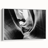 Framed canvas wall art depicting a stunning canyon landscape with rich earthy tones and intricate details, set against a sleek white frame for modern decor. This eye-catching piece enhances any interior space, perfect for nature enthusiasts and art lovers.