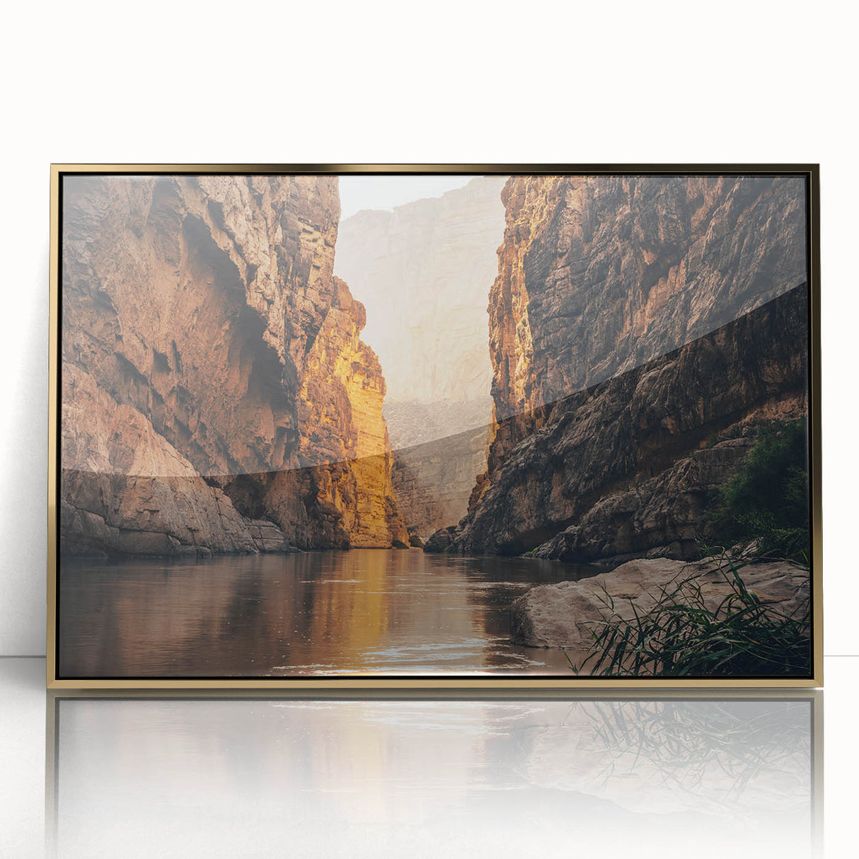Framed acrylic wall art featuring a stunning canyon landscape design with gold accents, showcasing vibrant colors and intricate details in a modern setting. Perfect for enhancing home decor with a touch of nature-inspired elegance.