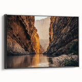 Framed canvas wall art showcasing a striking canyon landscape design, featuring rich earthy tones and a modern black frame, perfect for enhancing interior decor.