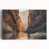 Stretched canvas wall art showcasing a vibrant canyon landscape, featuring rich earth tones and dynamic textures, perfect for enhancing home decor with natural beauty.