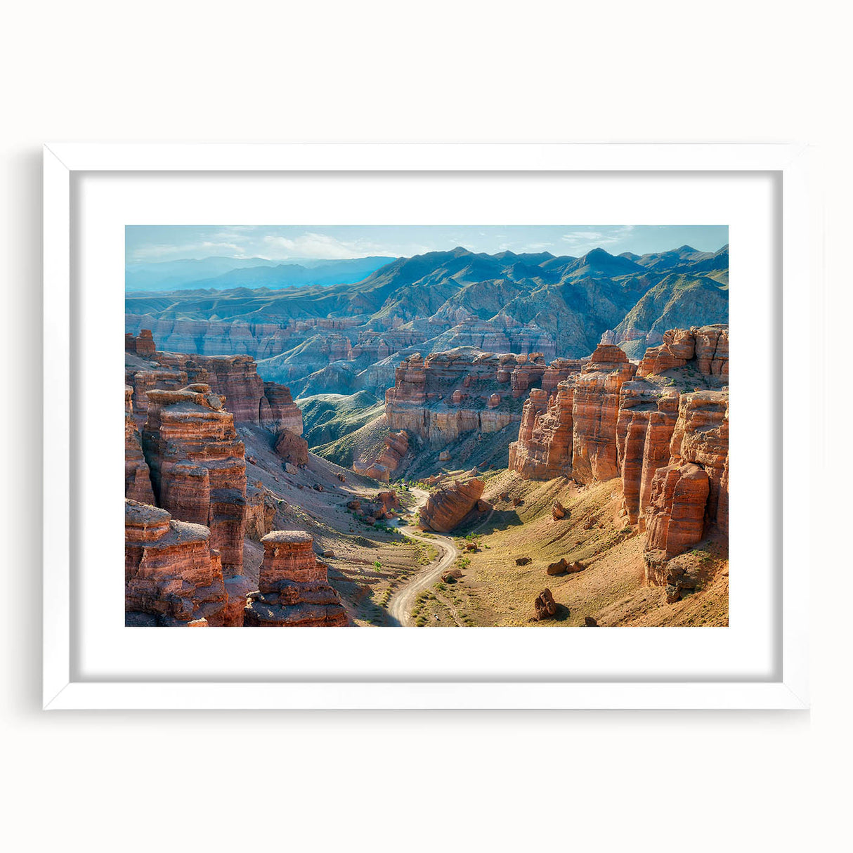 Framed wall art featuring a serene canyon landscape design with rich earthy tones, complete with a white mat for an elegant presentation. Perfect for enhancing home decor.