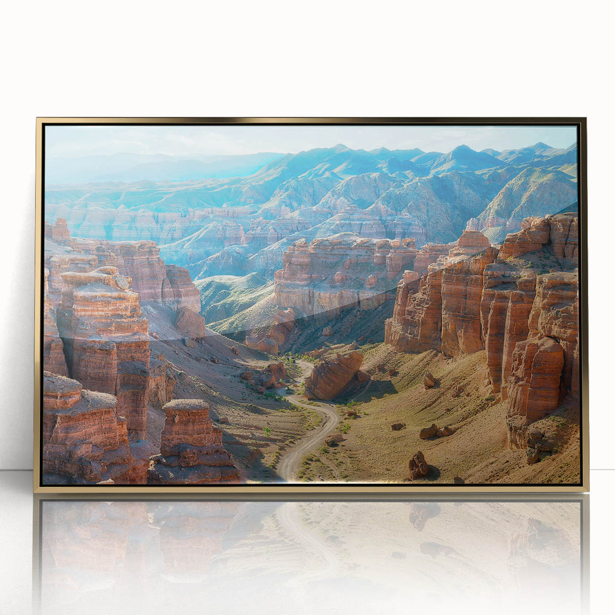 Framed acrylic wall art showcasing an abstract canyon landscape in gold hues, perfect for modern home decor, emphasizing elegance and sophistication.