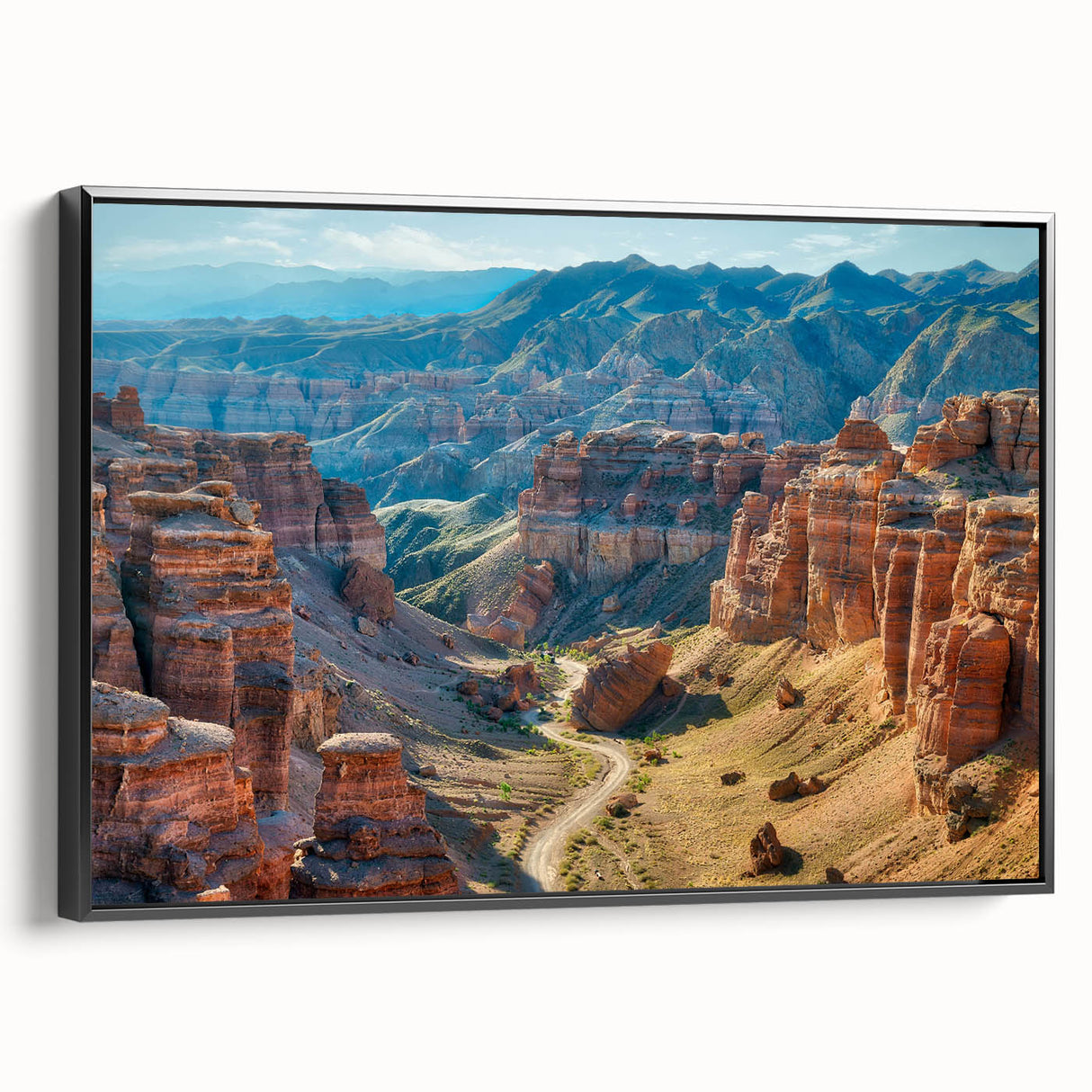 Framed canvas wall art showcasing a stunning canyon landscape design in vibrant colors, presented from a side view against a neutral background, perfect for home decor.