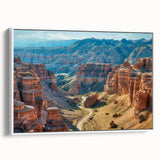 Framed canvas artwork showcasing a stunning canyon landscape with vibrant colors, displayed against a white wall, creating an elegant home decor accent.