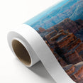 Vibrant rolled canvas showcasing a stunning desert canyon landscape in warm earthy tones, ideal for home decor, presented in a protective cardboard tube.