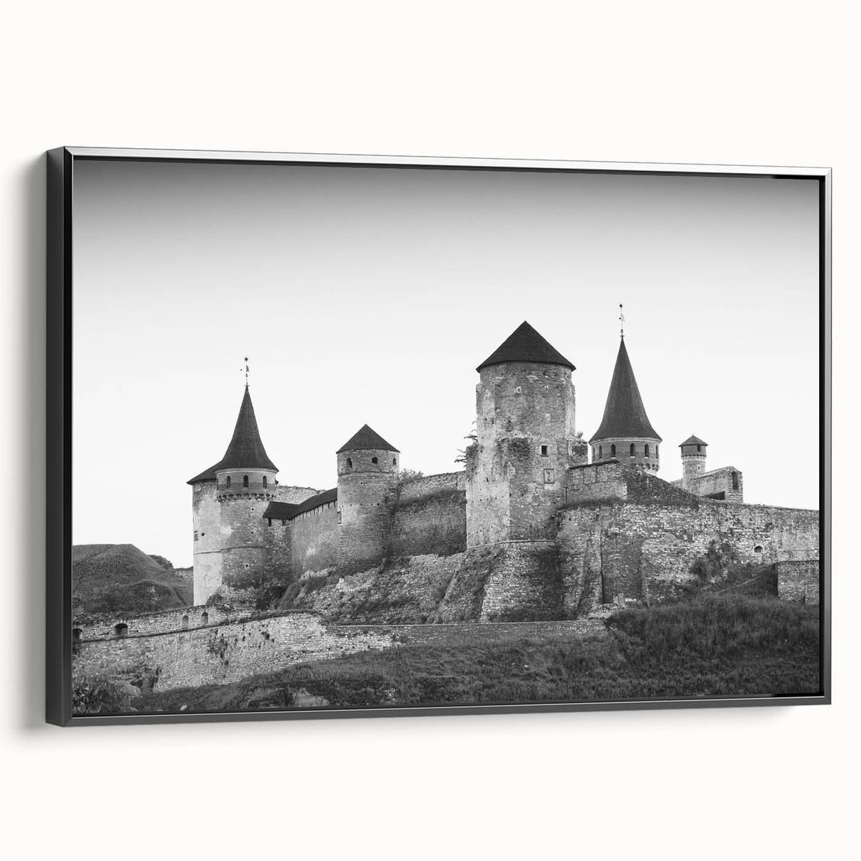 Framed canvas wall art showcasing a stunning castle landscape design, featuring rich colors and intricate details, presented in a sleek black frame, ideal for home decor.