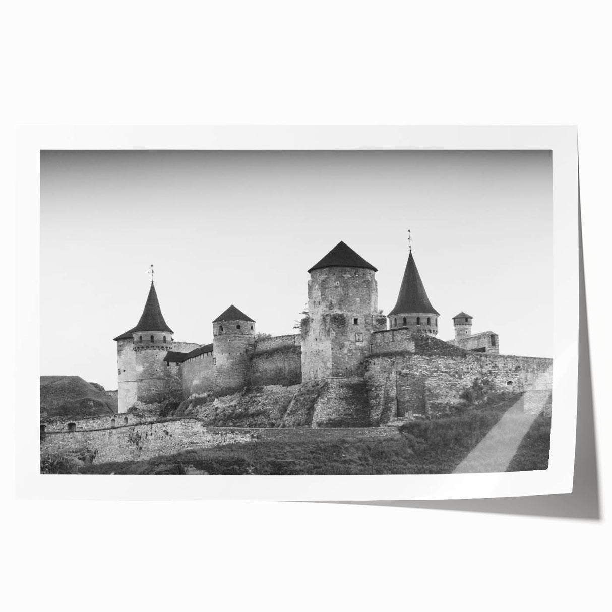 Stunning rolled print of a vibrant landscape featuring a majestic castle surrounded by lush greenery, perfect for home decor and art enthusiasts. The artwork captures a serene ambiance, enhancing any interior space with elegance and charm.