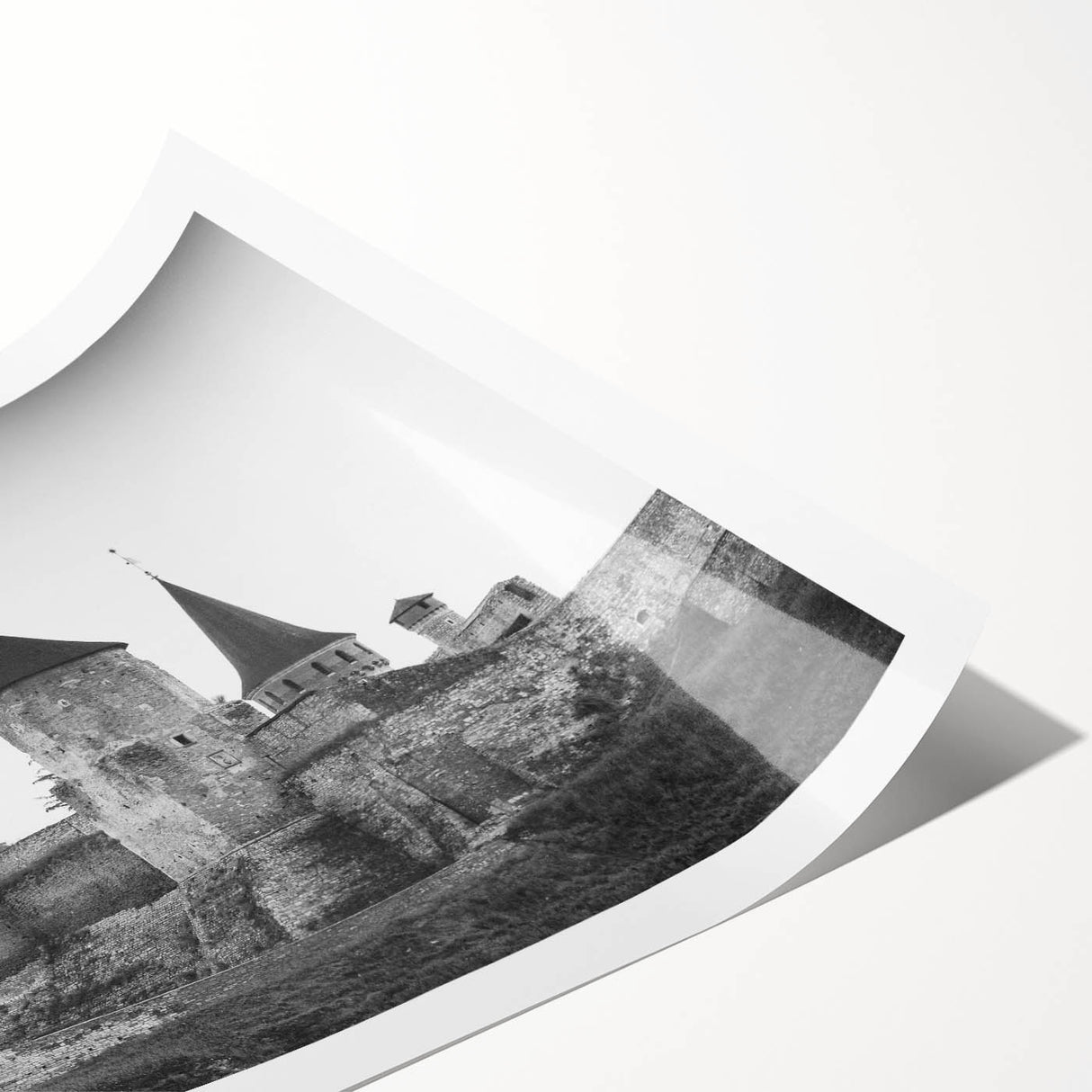 Vibrant rolled print showcasing a scenic landscape with a majestic castle and lush greenery, designed for wall art collection, emphasizing artistic elegance and home decor.