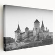 Stretched canvas wall art showcasing a picturesque landscape with a majestic castle, framed in a side view, ideal for home decor and interior design enthusiasts.