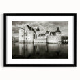 Framed wall art collection showcasing a stunning landscape with a castle design, featuring a sleek black frame and white mat, ideal for home decor enhancement.