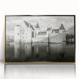 Framed acrylic wall art featuring a stunning landscape with a medieval castle, surrounded by lush greenery and a vibrant blue sky, perfect for home decor. This elegant design adds a touch of sophistication to any room.