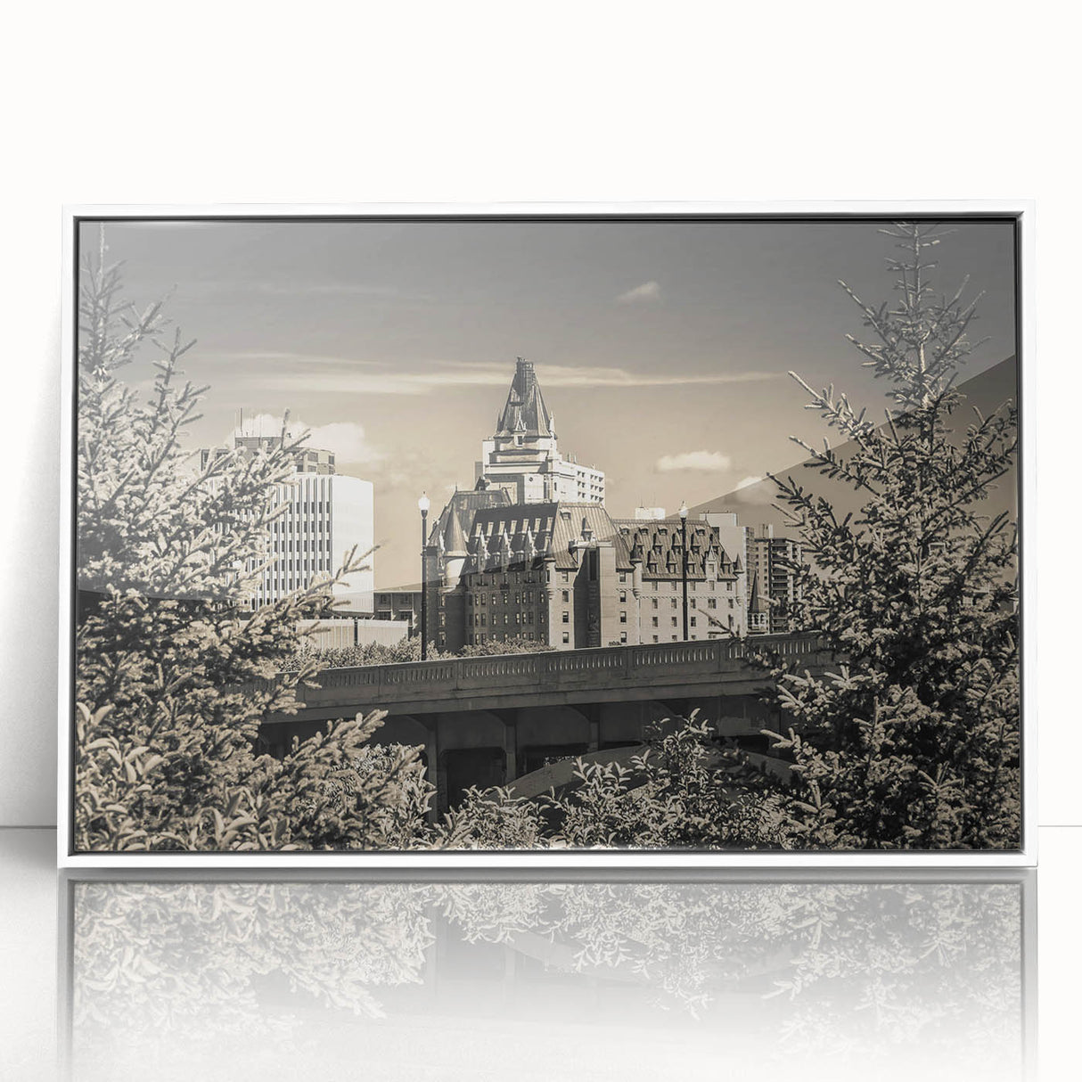 Framed wall art showcasing a vibrant landscape with a majestic castle set against a serene blue sky, featuring a white frame that enhances the artwork's elegance.