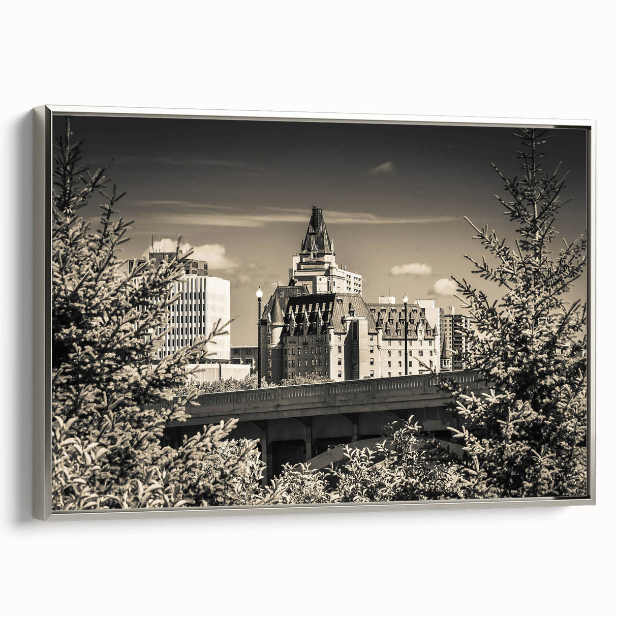 Framed canvas wall art showcasing a stunning landscape with a majestic castle, accented by a silver frame, ideal for enhancing home decor and elegance.