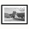 Framed wall art featuring a stunning landscape of a castle, set in a black frame with a white mat, showcasing intricate details and vibrant colors, perfect for home decor.