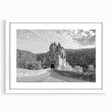Framed wall art showcasing a picturesque landscape of a medieval castle, featuring a white mat and sleek frame, ideal for home decor and interior design enthusiasts.