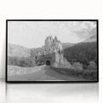 Framed acrylic wall art showcasing a stunning landscape with a medieval castle, featuring a black frame and vivid colors, perfect for home decor or office spaces.