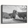 Framed wall art showcasing a stunning landscape with a castle, featuring a black frame and side view display, ideal for enhancing home decor with elegance.