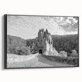 Framed wall art showcasing a stunning landscape with a castle, featuring a black frame and side view display, ideal for enhancing home decor with elegance.