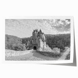 Rolled print of a stunning landscape featuring a medieval castle surrounded by lush greenery and a vibrant blue sky, ideal for home decor and art lovers.