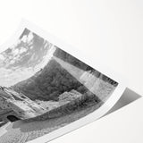 Rolled print of a scenic landscape featuring an elegant castle surrounded by lush greenery and vibrant blue skies, perfect for home decor and art enthusiasts.