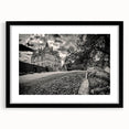 Framed black wall art showcasing a detailed landscape of a majestic castle, complete with a mat for added elegance, ideal for home decor and enhancing interior aesthetics.