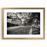 Elegant gold-framed wall art featuring a stunning landscape and castle design, complete with a white mat. This decorative piece adds a touch of sophistication to any room.