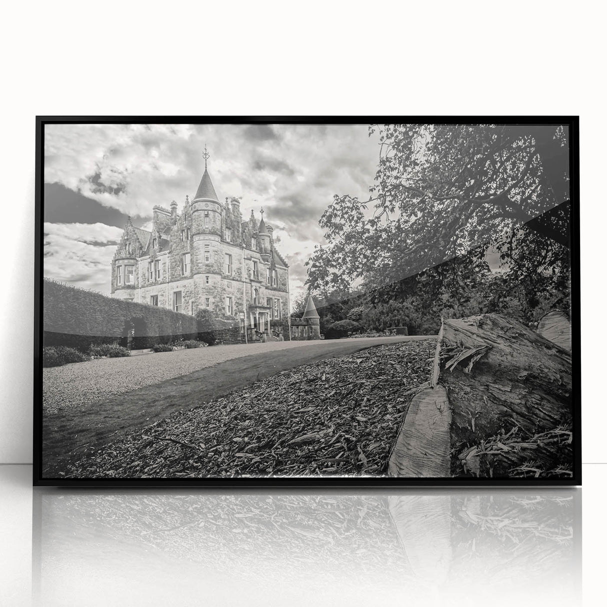 Framed wall art featuring a stunning landscape of a castle, designed with intricate details and a sleek black frame, perfect for home decor and interior design enthusiasts.