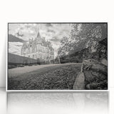 Framed acrylic wall art featuring a picturesque landscape with a castle design, displayed against a white background, perfect for enhancing home decor.