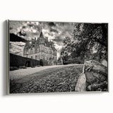 Framed canvas wall art depicting a picturesque landscape with a castle, featuring silver accents and a contemporary design, ideal for home decor.