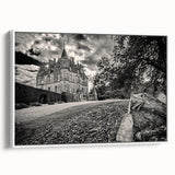 Framed canvas wall art featuring a serene landscape with a majestic castle, showcased against a white background, perfect for home decor and interior design.