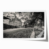 Vibrant rolled print showcasing a detailed landscape castle design, featuring lush greenery and a clear blue sky, ideal for home decor and art enthusiasts.