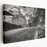 Stretched canvas artwork showcasing a picturesque landscape with a majestic castle, featuring vibrant colors and intricate details, ideal for home decor.