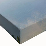 Close-up of a stretched canvas wall art piece depicting a vibrant landscape with a majestic castle, showcasing rich colors and intricate details, ideal for home decor.